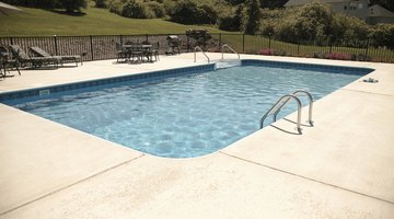 view of a swimming pool in the backyard of a house