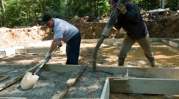 Construction workers pouring concrete.