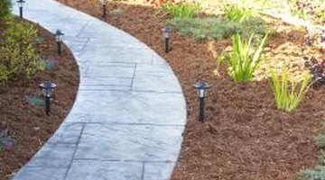 Mulch blocks light and water from reaching weed seeds.