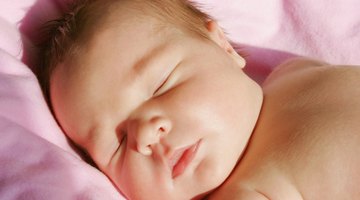 Newborn baby gets breastfeeding