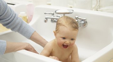 newborn baby in bathtub