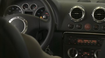 Person changing gear in car, close-up of hand on lever