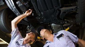 Mechanic inspecting tire