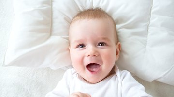 Side view of mother laughing with baby