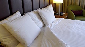 Fancy pillows on hotel bed