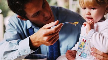 Thoughtful preschooler girl refusing to eat