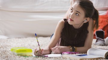 Little girl doing her homework at home