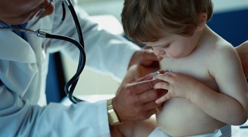 Doctor Examining sick little boy