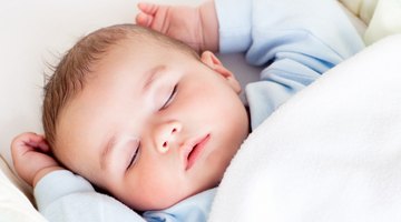Newborn Girl Sleeping in Swaddle
