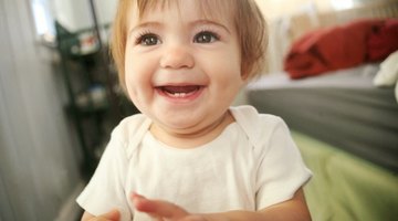 baby playing when sitting in crib