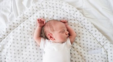 High angle view of woman breastfeeding baby