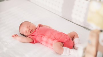 Adorable little girl sleeping in her bed