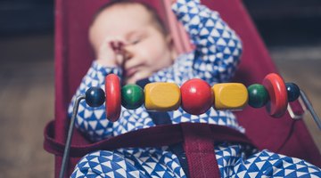 Portrait of a peaceful baby sleeping in his cradle at home