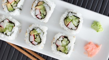 Chef slicing sushi