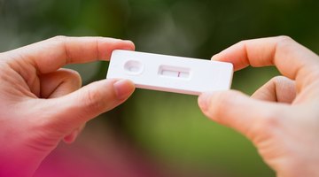 Woman with pregnancy test