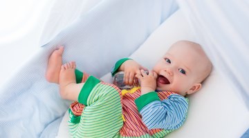 Mother changing baby diaper