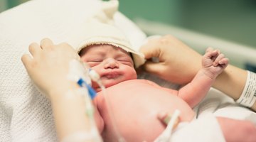 Pregnant woman holding belly in pharmacy