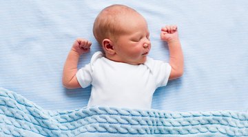 Pediatrician examining baby