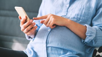 Woman holding pregnancy test