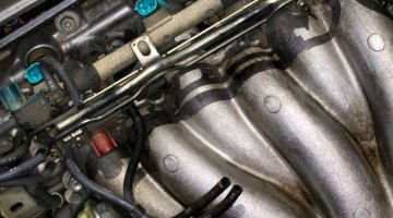 Cap on coolant overflow reservoir in car engine