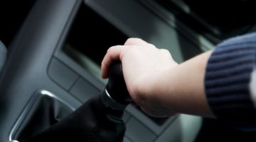 hands of driver on the steering wheel