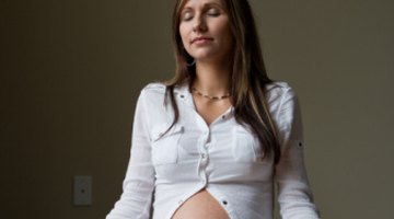 Relax pregnant woman meditating at home