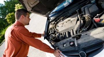Auto mechanic fixing vehicle