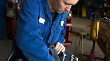 Mechanics under car on lift