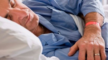 Girl (6-7) yawning in bed, eyes closed, elevated view