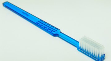 Soft bristles help loosen remaining glue particles.