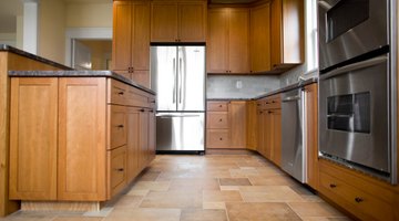 Tile covers imperfections in an old linoleum floor.