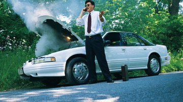 Close up of a woman examining the engine of a car