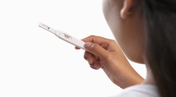 Young woman looking at her contraceptive pills