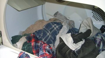 Load clothes into the dryer