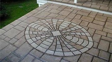 More elaborate stamped concrete patios resemble pieces of artwork.
