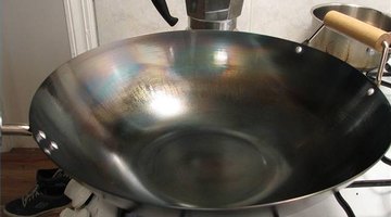 A wok is not recommended for use on a glass range.