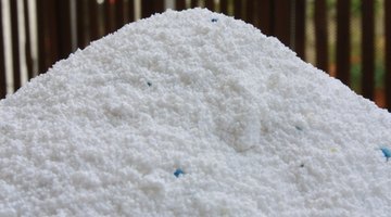 Powdered laundry detergent makes an oil stain-removing paste.