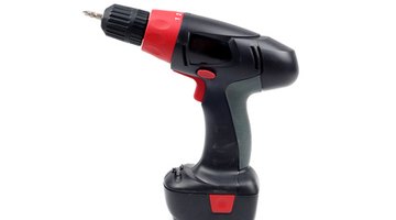 A cordless screwdriver quickly fastens the Premium Pro-Snap roofing panels.