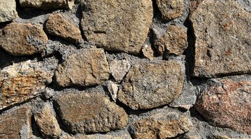 If framing feels difficult,  mortar rocks into  walls one large stone at a time.