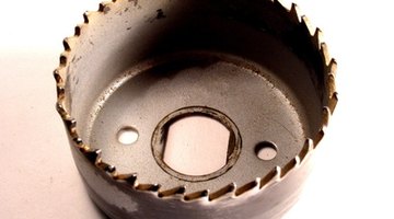 Use a hole saw to cut your vent pipe hole.