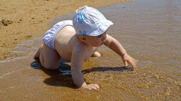 Father playing with baby boy (2-5 months)