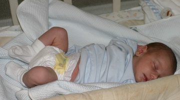 Peaceful baby lying on a bed while sleeping