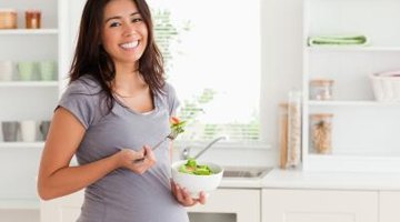 Pregnant woman in a garden