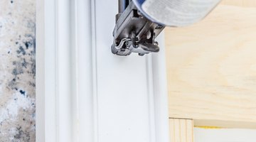 Attaching the crown molding to the top of the headboard to accentuate the beauty of the headboard