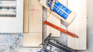 Wood glue and a brad nailer are used to secure each layer of the shutter headboard