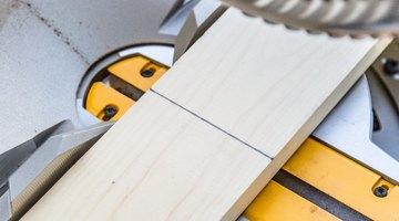 Use a miter saw to evenly cut the vertical planks to the desired height