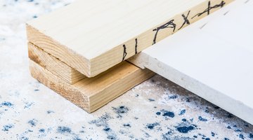 The shutter is sandwiched between the planks that will act as the legs of the headboard