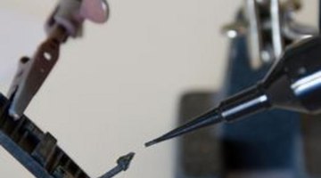 Apply small amounts of glue with care to preserve the appearance of the model.