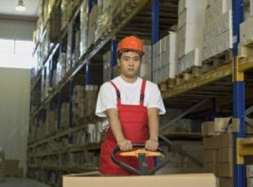 Pallet jacks are used by workers in warehouses to move freight.