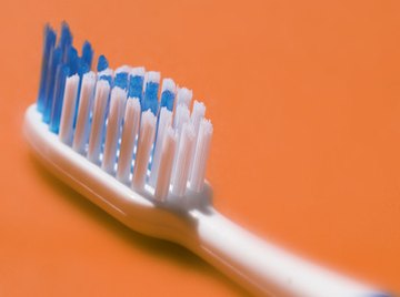 A toothbrush with slanted bristles provides the imbalance needed to get this simple robot moving.